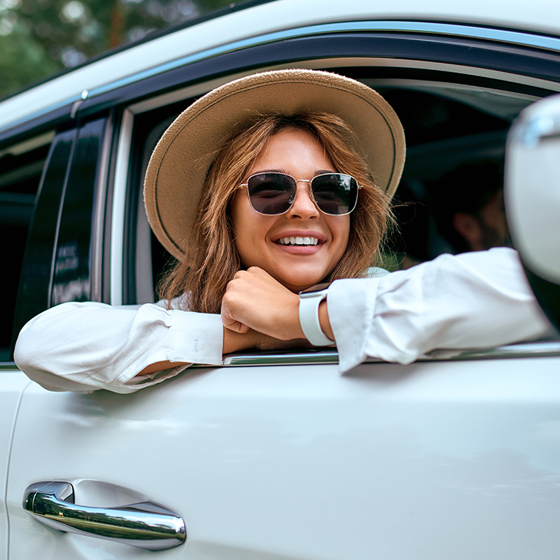 Bennett Pre-Owned of Lebanon is a Car Dealership in Lebanon near Palmyra, PA | Smiling Woman with Head Out Open Car Window Enjoying Warm Day