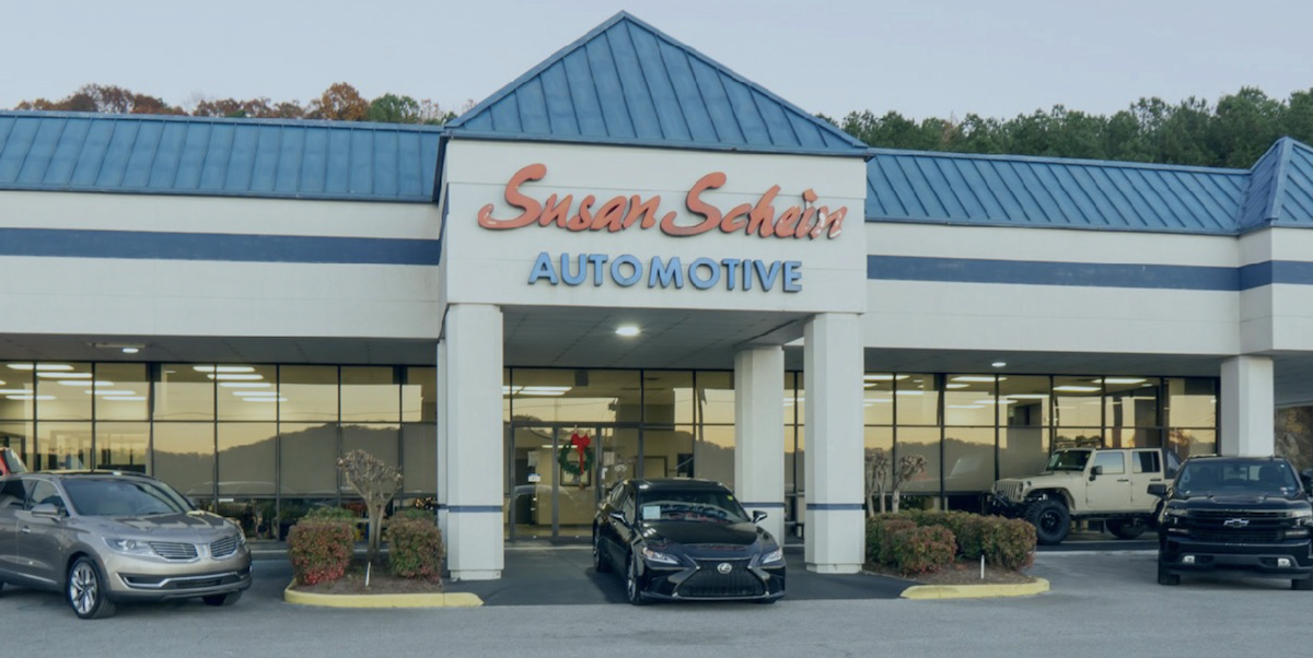 Front View of Susan Schein Dealership with used cars in front